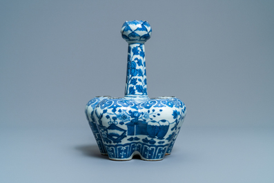 A Chinese blue and white tulip vase with antiquities, 19th C
