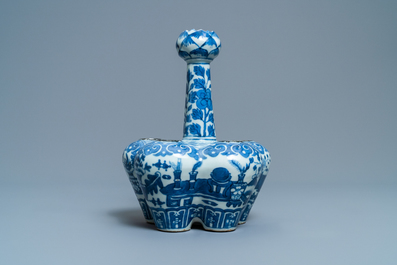 A Chinese blue and white tulip vase with antiquities, 19th C