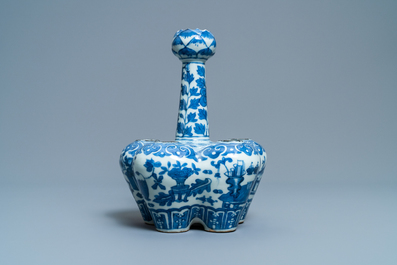 A Chinese blue and white tulip vase with antiquities, 19th C
