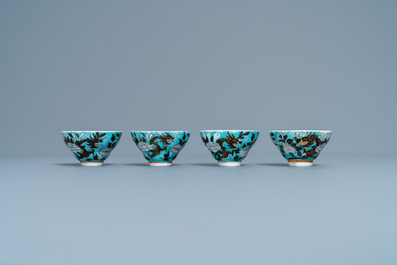 Four Chinese blue-ground Dayazhai-style 'dragon' cups and saucers, 19th C.