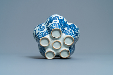 A Chinese blue and white tulip vase with antiquities, 19th C