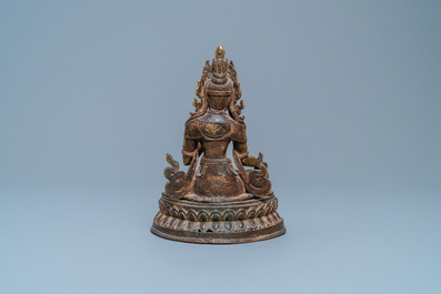 A Nepalese gilt bronze figure of White Tara, 16th C.