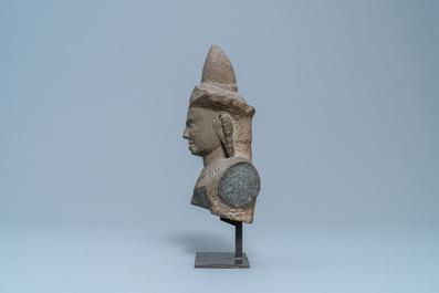 A grey sandstone bust of vishnu, Cambodia, Khmer, Angkor Wat period, 12th C.
