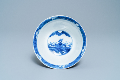 A Chinese blue and white 'dragon and carps' bowl, Xuande mark, Kangxi