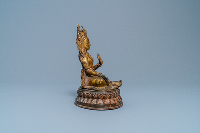 A Nepalese gilt bronze figure of White Tara, 16th C.