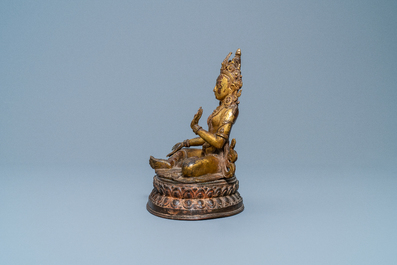 A Nepalese gilt bronze figure of White Tara, 16th C.
