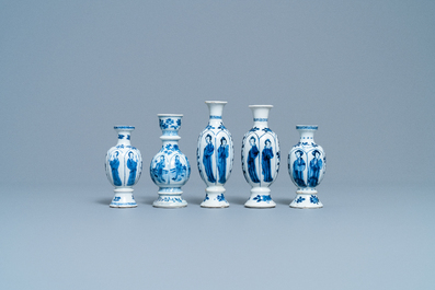 Four Chinese blue and white miniature vases and a huqqa base, Kangxi