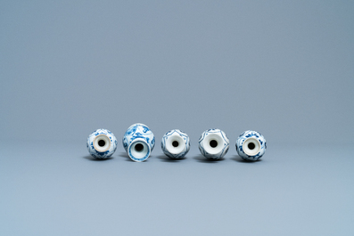 Four Chinese blue and white miniature vases and a huqqa base, Kangxi