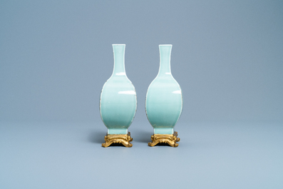 A pair of Chinese monochrome celadon vases with gilt bronze mounts, 18/19th C.
