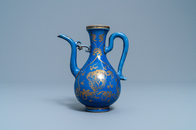 A Chinese gilt-decorated powder blue-ground jug with mythical beasts, Kangxi