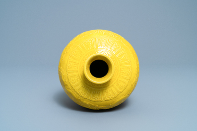 A Chinese relief-moulded monochrome yellow meiping 'dragon' vase, Republic