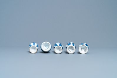 Four Chinese blue and white miniature vases and a huqqa base, Kangxi