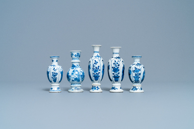 Four Chinese blue and white miniature vases and a huqqa base, Kangxi