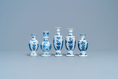 Four Chinese blue and white miniature vases and a huqqa base, Kangxi