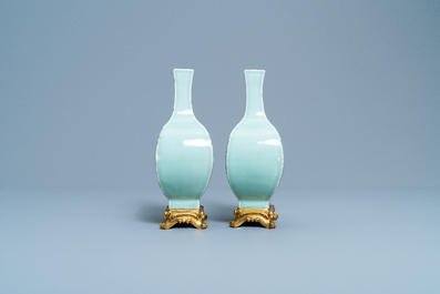 A pair of Chinese monochrome celadon vases with gilt bronze mounts, 18/19th C.