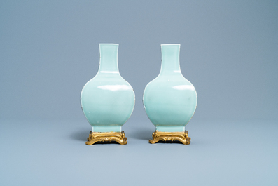 A pair of Chinese monochrome celadon vases with gilt bronze mounts, 18/19th C.
