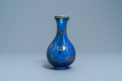 A Chinese gilt-decorated powder blue-ground jug with mythical beasts, Kangxi