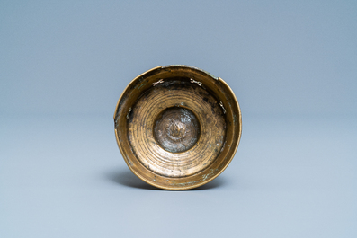 A Flemish or Dutch bronze candlestick, 14/15th C.