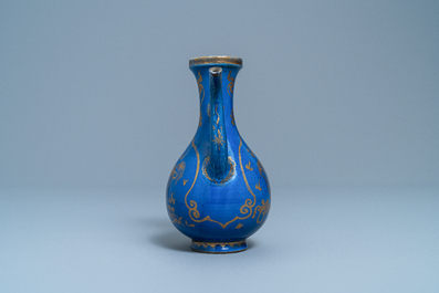 A Chinese gilt-decorated powder blue-ground jug with mythical beasts, Kangxi