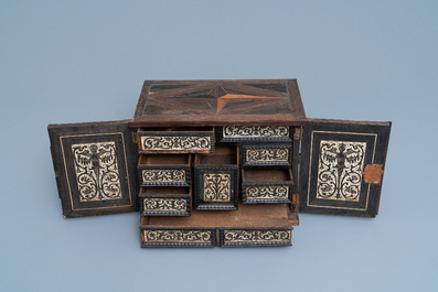 A Dutch wood marquetry and bone inlay table cabinet, 17th C.
