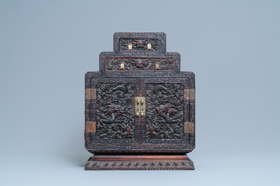 Un petit cabinet en bois sculpt&eacute; &agrave; d&eacute;cor de dragons, Chine, R&eacute;publique