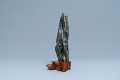 A Chinese scholar's dream stone on wooden stand, 19th C.