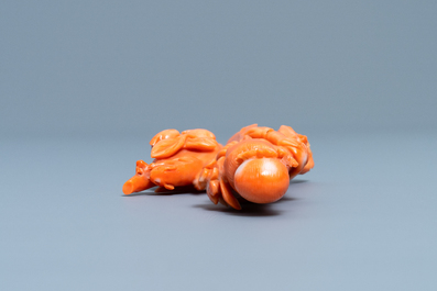A Chinese carved red coral group of a lady, a squirrel and a rabbit, 19/20th C.