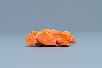 A Chinese carved red coral group of a lady, a squirrel and a rabbit, 19/20th C.