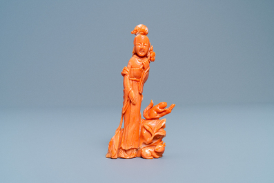A Chinese carved red coral group of a lady, a squirrel and a rabbit, 19/20th C.