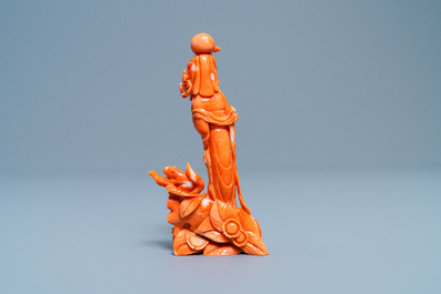 A Chinese carved red coral group of a lady, a squirrel and a rabbit, 19/20th C.