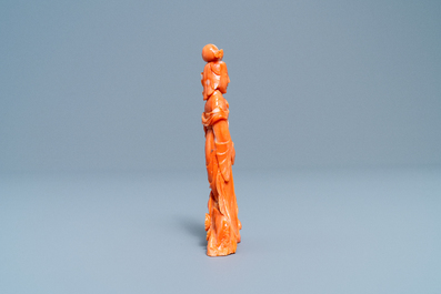 A Chinese carved red coral group of a lady, a squirrel and a rabbit, 19/20th C.