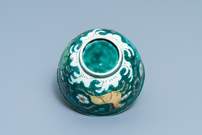A Chinese verte biscuit bowl with horses, Kangxi