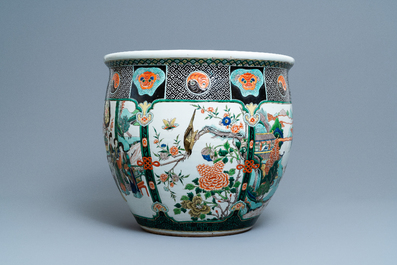 A large Chinese famille verte relief-moulded fish bowl, 19th C.