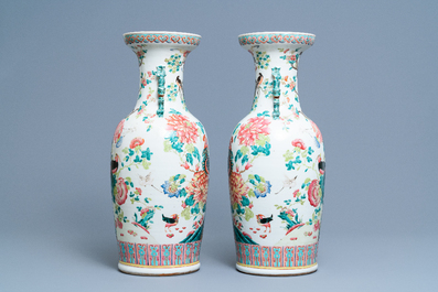 A pair of Chinese famille rose vases with birds among blossoming branches, 19th C.