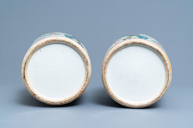 A pair of Chinese famille rose vases with birds among blossoming branches, 19th C.
