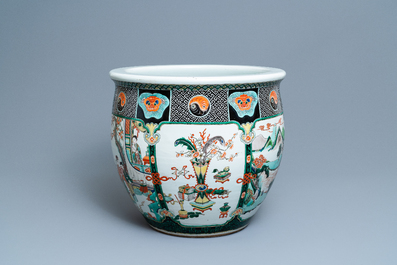 A large Chinese famille verte relief-moulded fish bowl, 19th C.