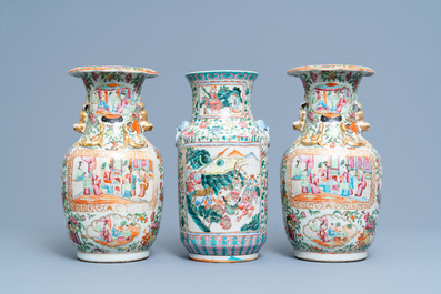 A pair of Chinese Canton famille rose vases and a single vase, 19th C.