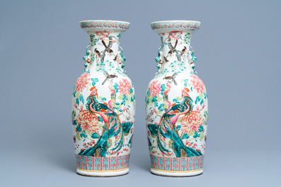 A pair of Chinese famille rose vases with birds among blossoming branches, 19th C.