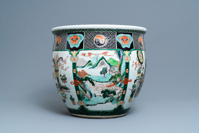A large Chinese famille verte relief-moulded fish bowl, 19th C.