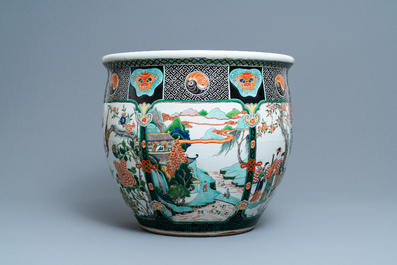 A large Chinese famille verte relief-moulded fish bowl, 19th C.