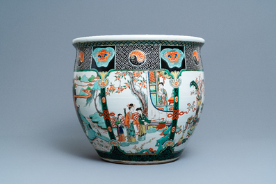 A large Chinese famille verte relief-moulded fish bowl, 19th C.