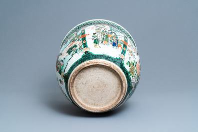 A large Chinese famille verte relief-moulded fish bowl, 19th C.