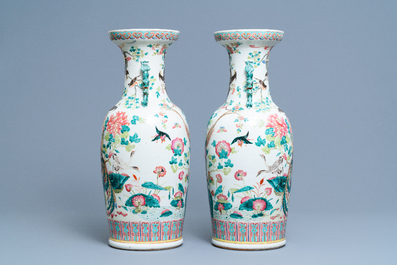 A pair of Chinese famille rose vases with birds among blossoming branches, 19th C.