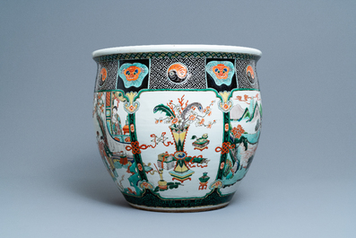 A large Chinese famille verte relief-moulded fish bowl, 19th C.