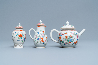 A Chinese famille rose teapot, tea caddy, milk jug and tray, Qianlong