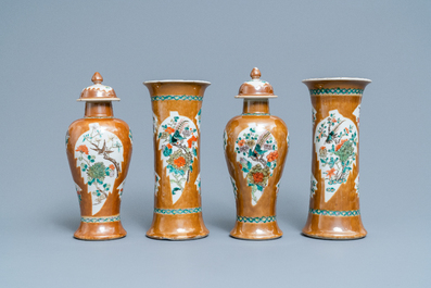 A Chinese famille verte capucin brown-ground four-piece garniture, 19th C.