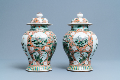 A pair of Chinese famille verte vases and covers, Kangxi mark, 19th C.