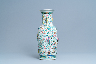A Chinese relief-moulded famille rose 'antiquities' vase, 19th C.