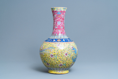 A large Chinese yellow-ground famille rose 'dragon and phoenix' bottle vase, 19th C.