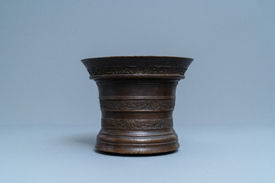 A large Flemish bronze mortar dated 1604 and inscribed Lille